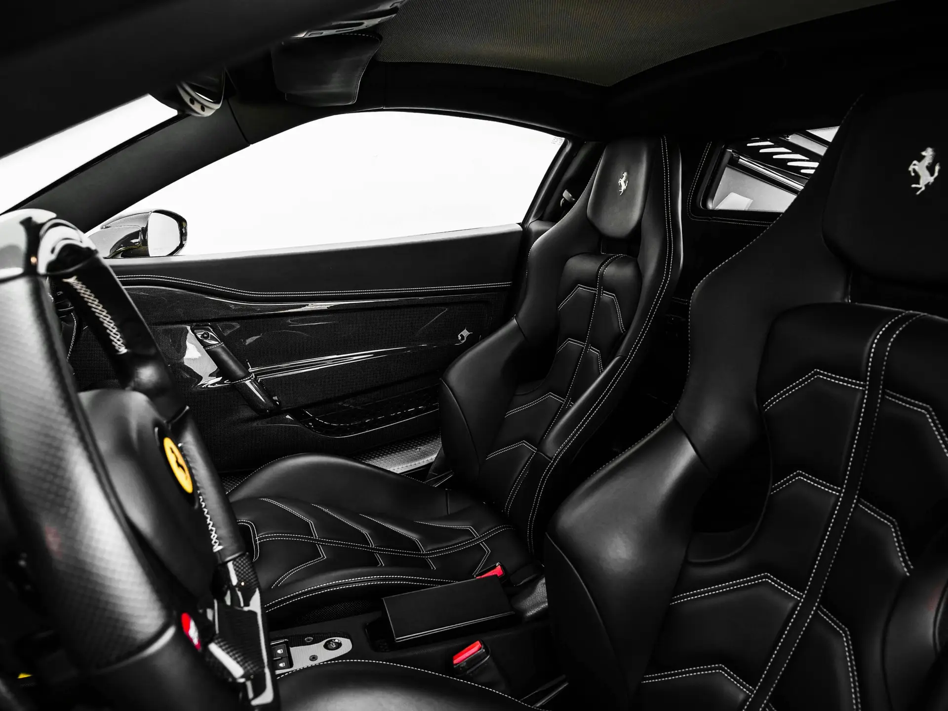 pexels-photo-3954434-3954434 Explore the sleek black leather interior and cutting-edge design of a Ferrari 488 Speciale.